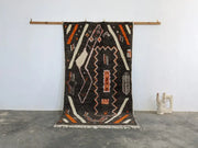 Black woven moroccan handmade azilal rug with bold orange white cream geometric patterns in pure natural wool 244 x 130 cm