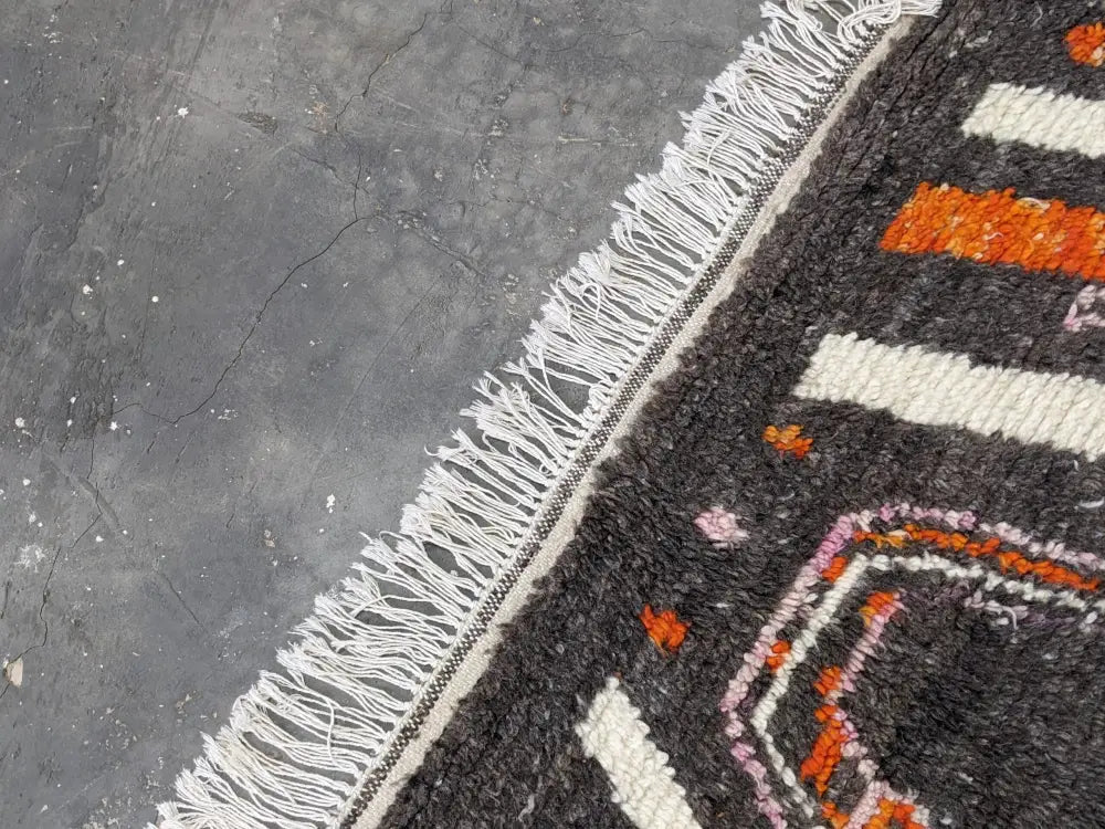 Black moroccan handmade azilal rug with white fringe geometric patterns in orange cream pink pure natural wool 244 x 130 cm