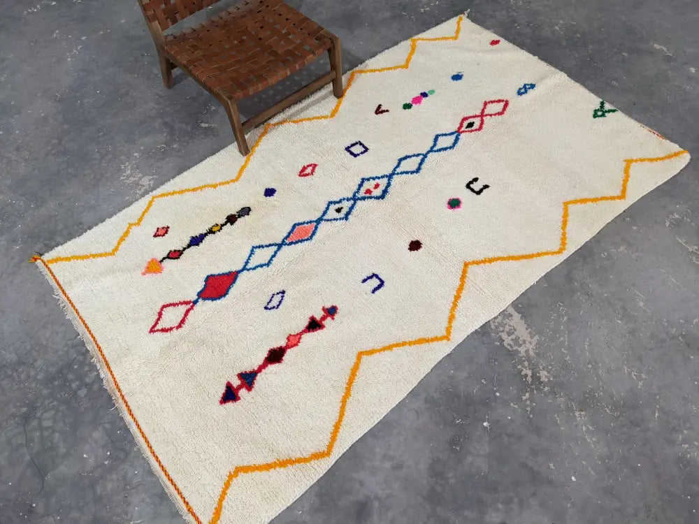 Cream-colored moroccan handmade azilal rug with vibrant geometric patterns in pure natural wool 246x143 cm