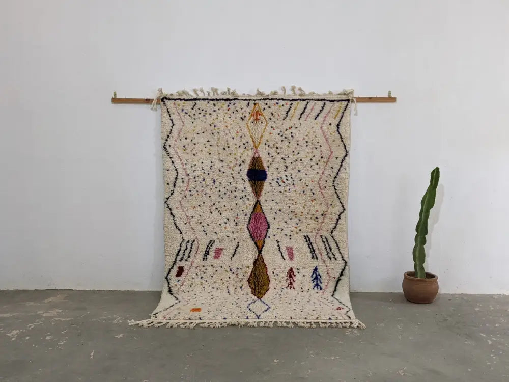 Beige moroccan handmade traditional azilal rug with geometric black pink and brown patterns 246 x 166 cm by DecorBites