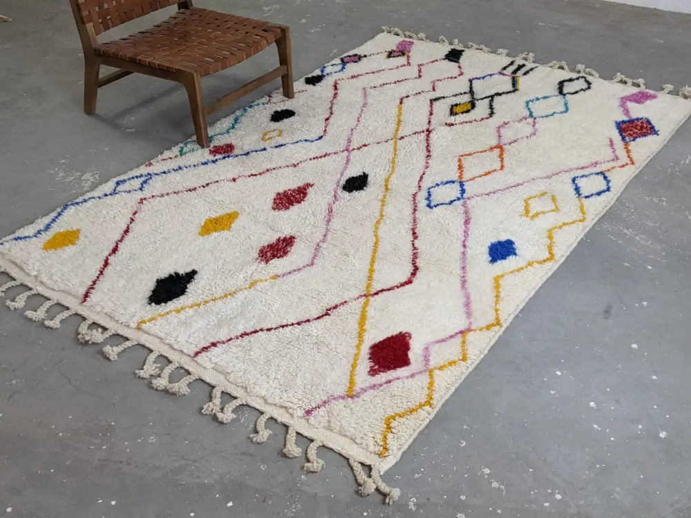 Cream-colored moroccan handmade traditional azilal rug with vibrant geometric pattern and tassels by decorbites™ 252 x 160 cm