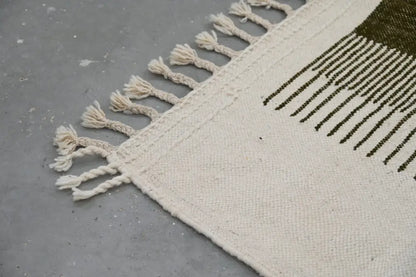 Cream-colored woven moroccan handmade traditional azilal rug with olive green stripes and fringed edge 253 x 145 cm