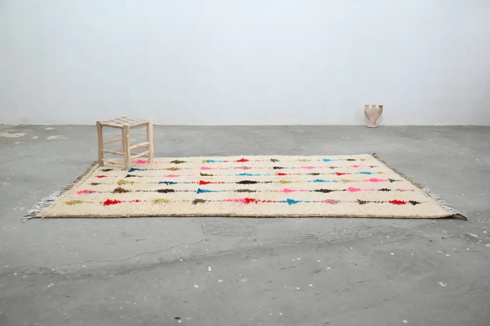 Beige decorbites moroccan handmade traditional azilal rug with colorful red blue pink and black geometric patterns 255 x 155 cm