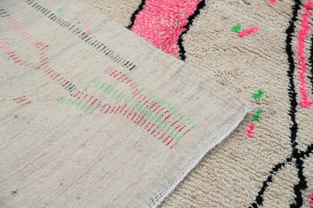 Beige Moroccan handmade traditional Azilal rug with vibrant pink green and black geometric patterns 256 x 136 cm