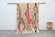 Beige moroccan handmade traditional azilal rug with bold pink black and green geometric patterns 256 x 136 cm