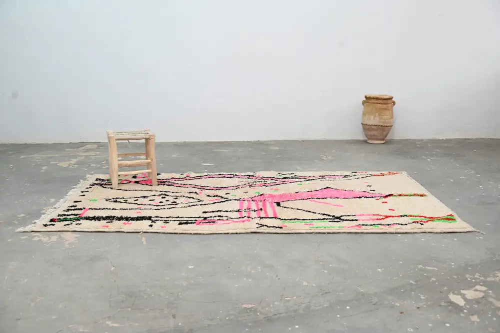 Beige moroccan handmade traditional azilal rug with vibrant pink black and green geometric patterns 256 x 136 cm
