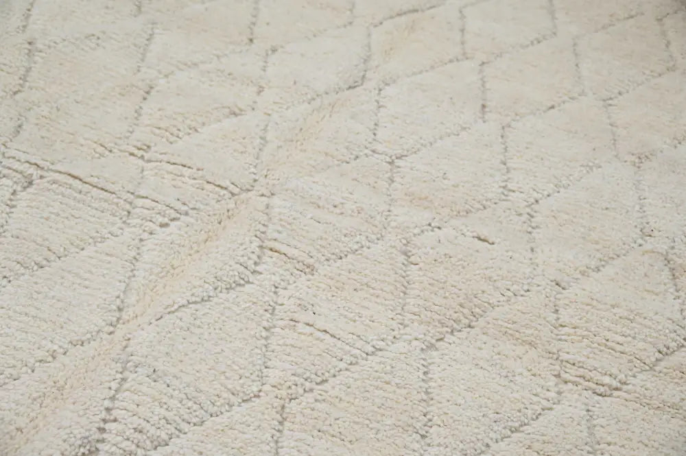 Cream-colored plush moroccan handmade traditional azilal rug with textured diamond pattern 256 x 157 cm
