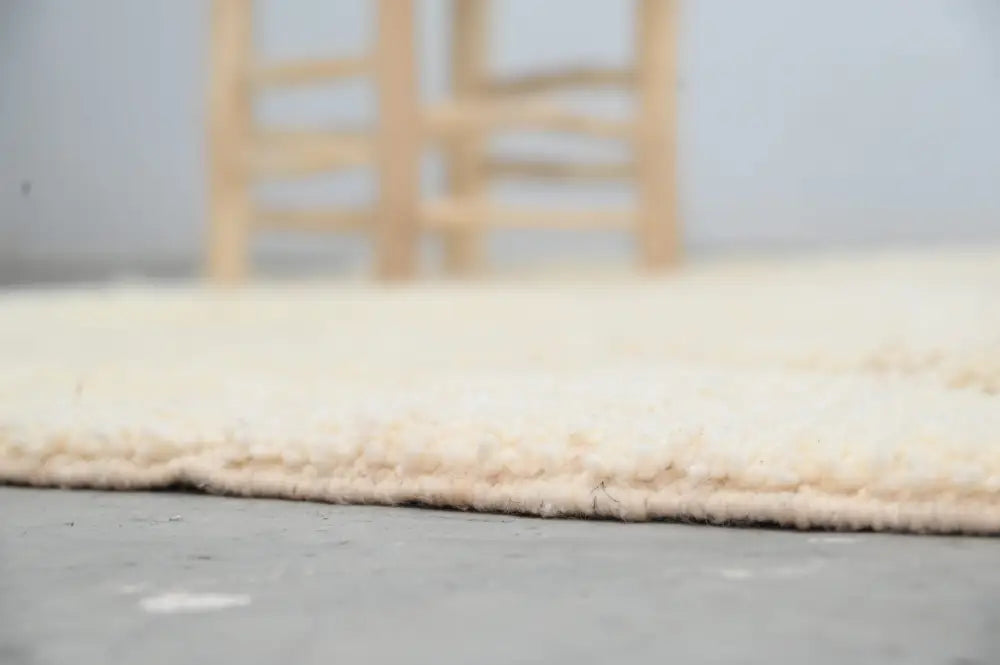 Cream-colored plush shaggy decorbites moroccan handmade traditional azilal rug with soft textured surface 256 x 157 cm