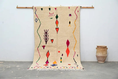 Beige moroccan handmade traditional azilal rug with vibrant red orange green and purple geometric patterns 260 x 148 cm
