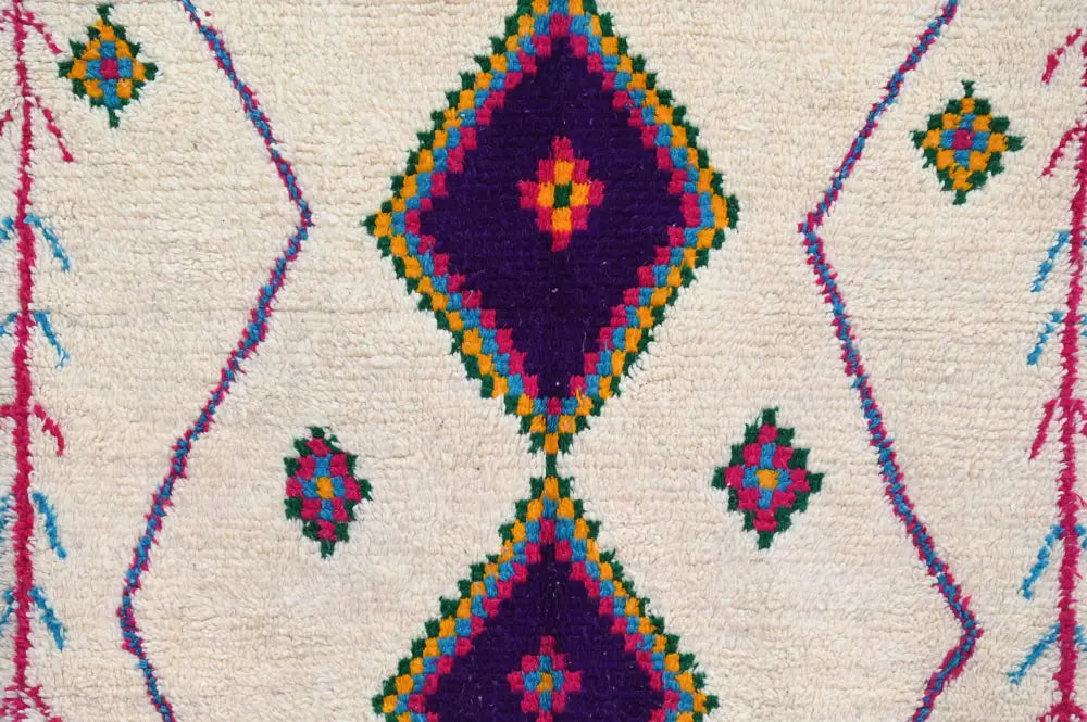 Decorbites™ moroccan handmade traditional azilal rug with vibrant purple diamonds and colorful borders on cream wool base