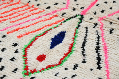 Decorbites™ moroccan handmade traditional azilal rug with vibrant geometric patterns in cream pink orange and black