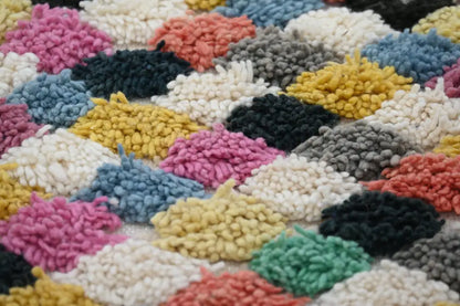 Colorful moroccan handmade traditional azilal rug with fluffy yarn clusters in pink yellow blue gray black and white