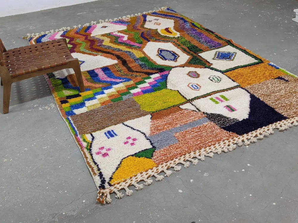 Vibrant multicolored geometric patterned decorbites moroccan handmade traditional azilal rug with fringed edges and texture