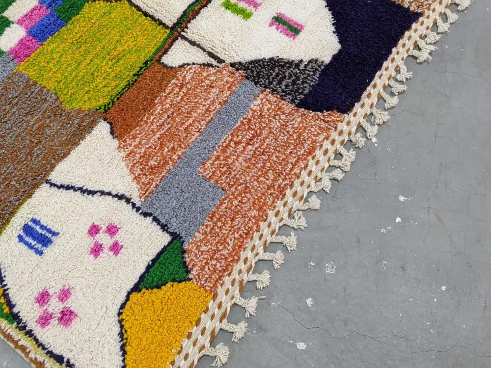 DecorBites™ moroccan handmade traditional azilal rug 304 x 200 cm with vibrant geometric patterns and cream-colored fringe