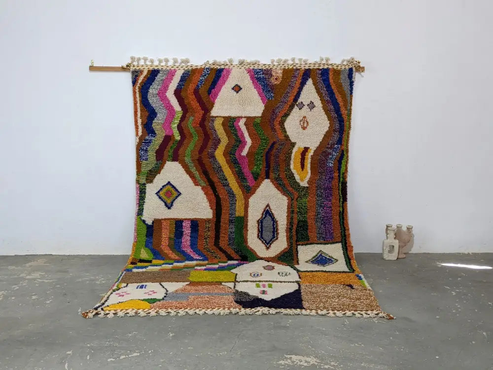 Vibrant multicolored moroccan handmade traditional azilal rug with geometric patterns and textured fringe by decorbites