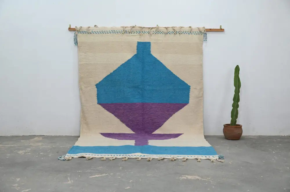 Beige woven moroccan handmade traditional azilal rug with bold turquoise purple geometric design and blue fringe 307 x 196 cm