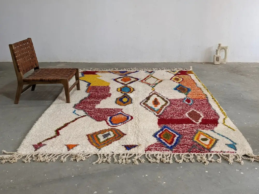 Vibrant cream moroccan handmade traditional azilal rug with multicolored geometric diamond motifs and fringed edges