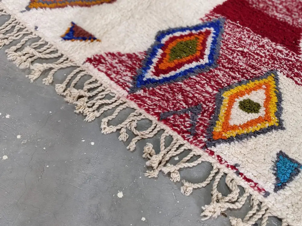 Decorbites™ moroccan handmade traditional azilal rug with cream base and bold geometric patterns in red blue orange green