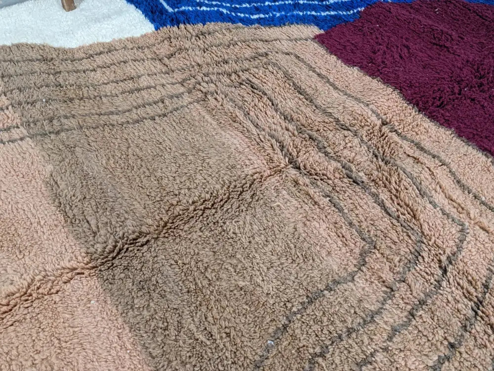 Beige woolen moroccan handmade traditional azilal rug with textured plush surface and geometric patterned design