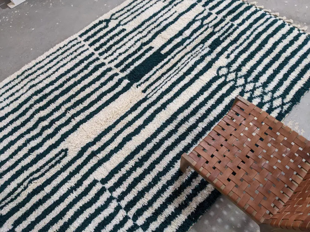 A plush shaggy moroccan handmade traditional azilal rug with bold black and cream geometric stripes 316 x 206 cm