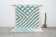 Beige and blue geometric patterned moroccan handmade traditional azilal rug with fringed edges by DecorBites™