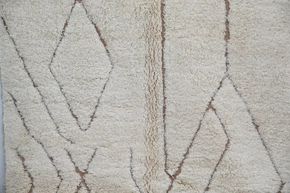Cream-colored plush wool beni ouarain rug with brown geometric stitched diamonds by DecorBites moroccan handmade design