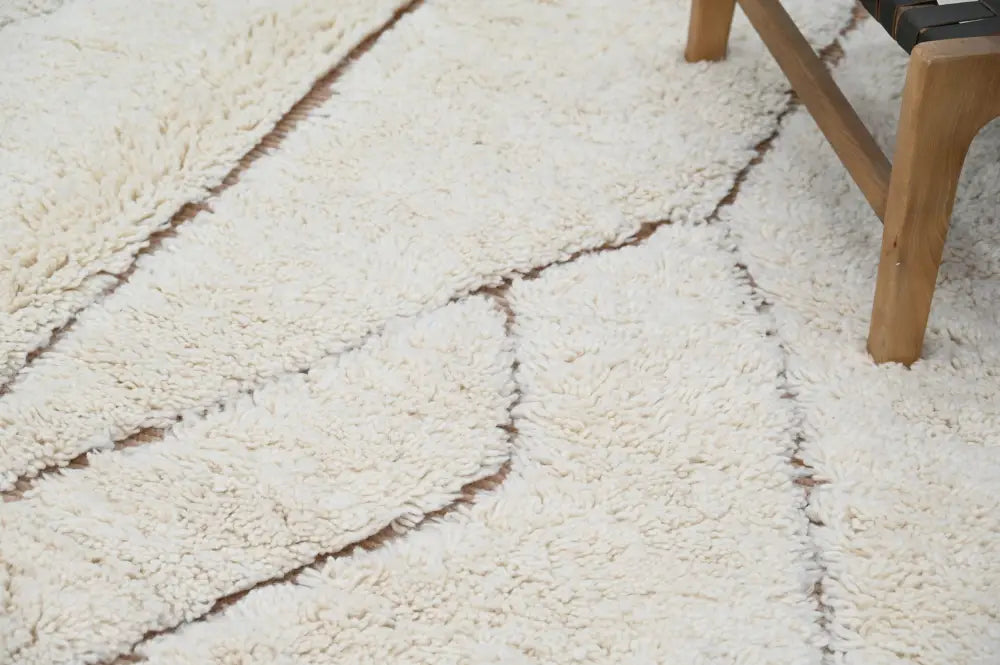 Cream-colored plush shag beni ouarain moroccan handmade traditional carpet with geometric stitched seams 283 x 211 cm