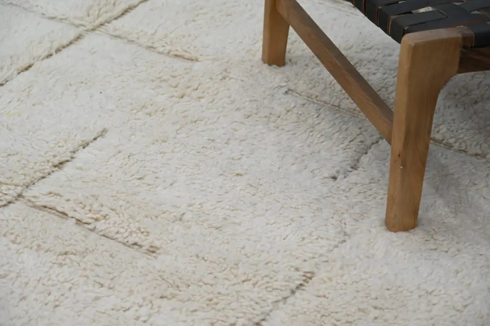 Cream-colored plush shaggy beni ouarain carpet with textured fluffy surface and visible seams moroccan handmade 300 x 205 cm