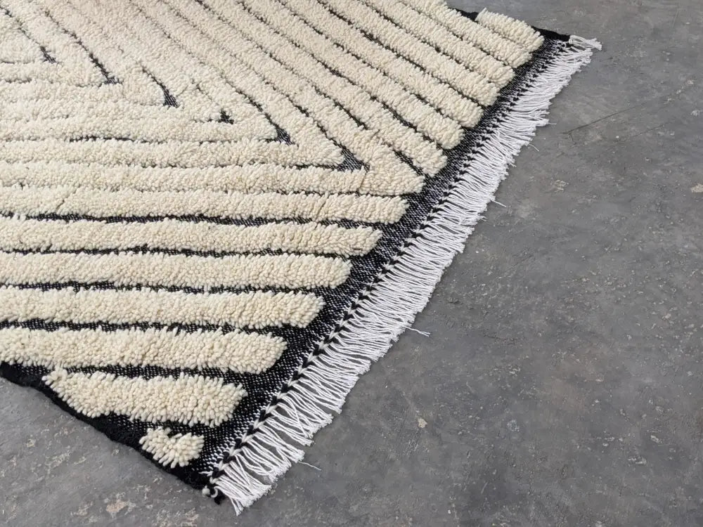 DecorBites™ moroccan handmade beni ouarain rug 245 x 146 cm with black and cream geometric plush stripes and white fringe