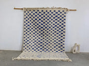 Decorbites moroccan handmade beni ouarain rug with blue and cream checkered pattern and fringed edges 260 x 170 cm