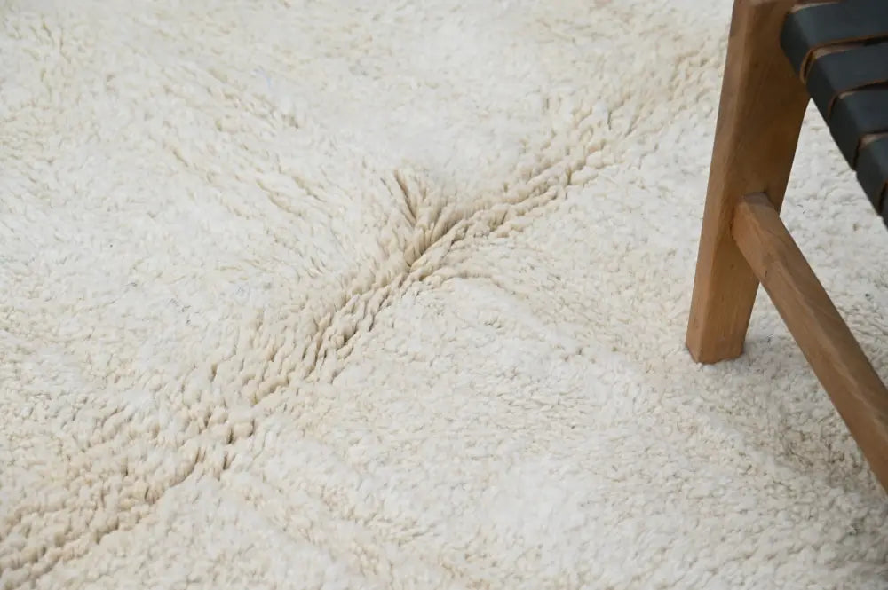Cream-colored plush shaggy beni ouarain rug with a soft textured surface moroccan handmade traditional design