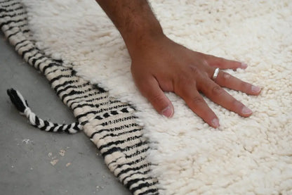 Plush white beni ouarain rug with bold black and white striped fringe moroccan handmade traditional design