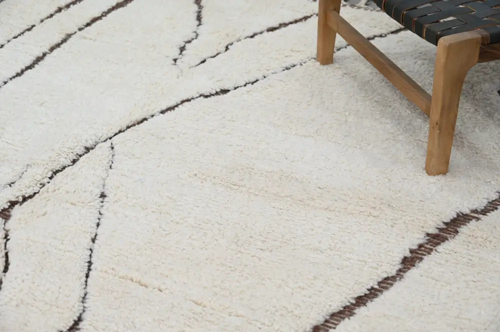 Cream-colored plush shag beni ouarain rug with bold black geometric stripes 290 x 214 cm by DecorBites™