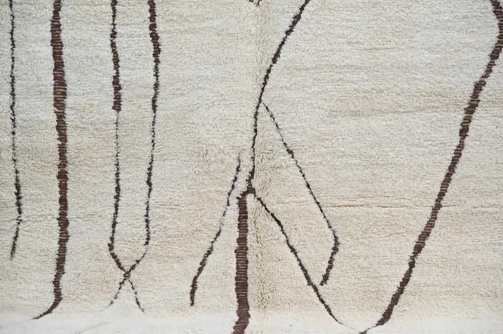 DecorBites™ Moroccan handmade traditional beni ouarain rug with cream wool and dark brown geometric patterns