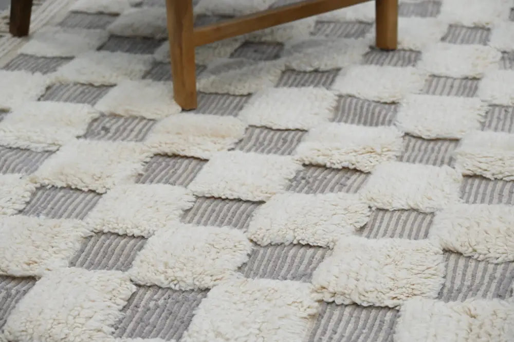 A cream and gray checkered textured woven beni ouarain rug by DecorBites™ measuring 300 x 203 cm