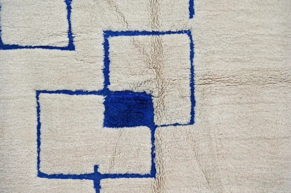 Cream-colored beni ouarain rug with bold blue geometric patterns moroccan handmade wool 300 x 207 cm