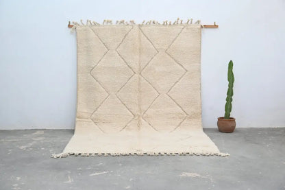 Beige moroccan handmade beni ouarain rug with diamond pattern and fringed edges 300 x 212 cm by decorbites