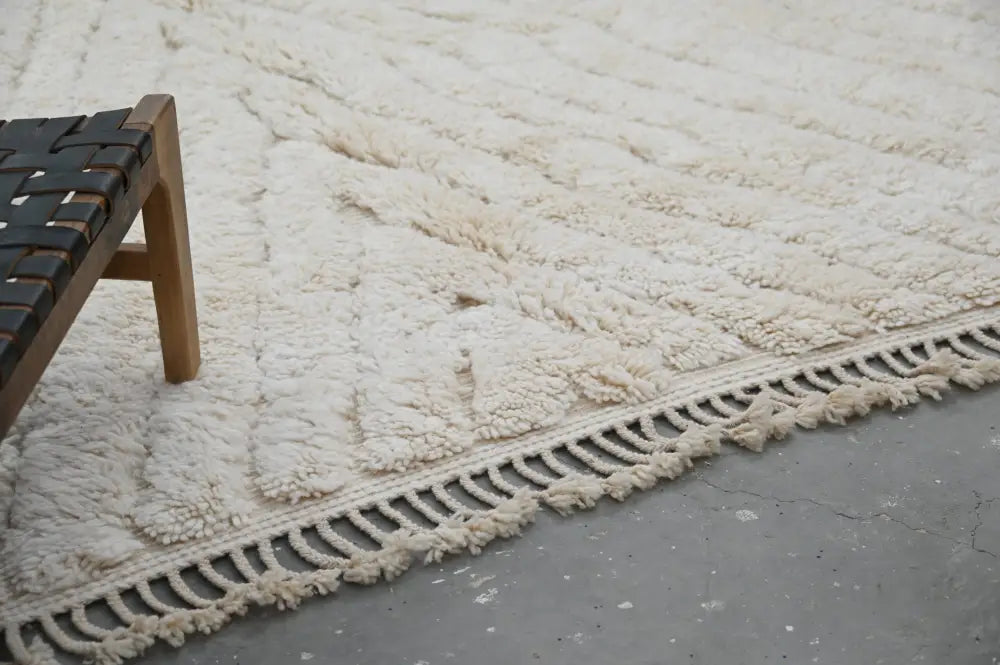 Cream-colored plush shaggy beni ouarain rug with textured surface and macrame fringe moroccan handmade 300 x 217 cm