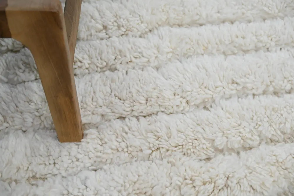 Cream-colored plush shaggy beni ouarain rug with soft textured surface moroccan handmade traditional design