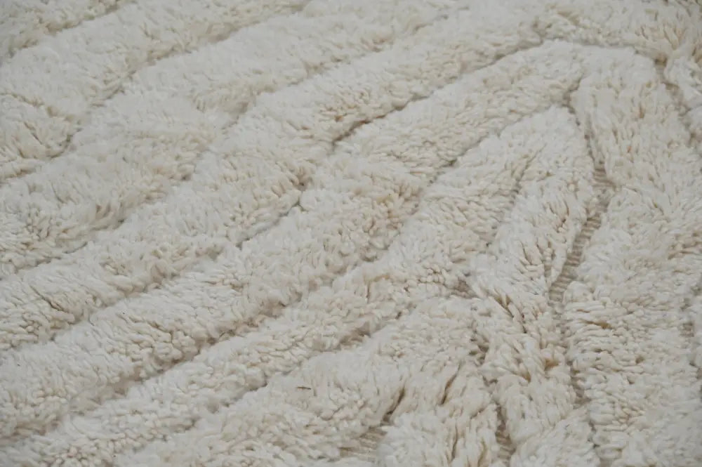 Cream-colored plush shaggy beni ouarain rug with a soft wavy ribbed pattern moroccan handmade traditional design