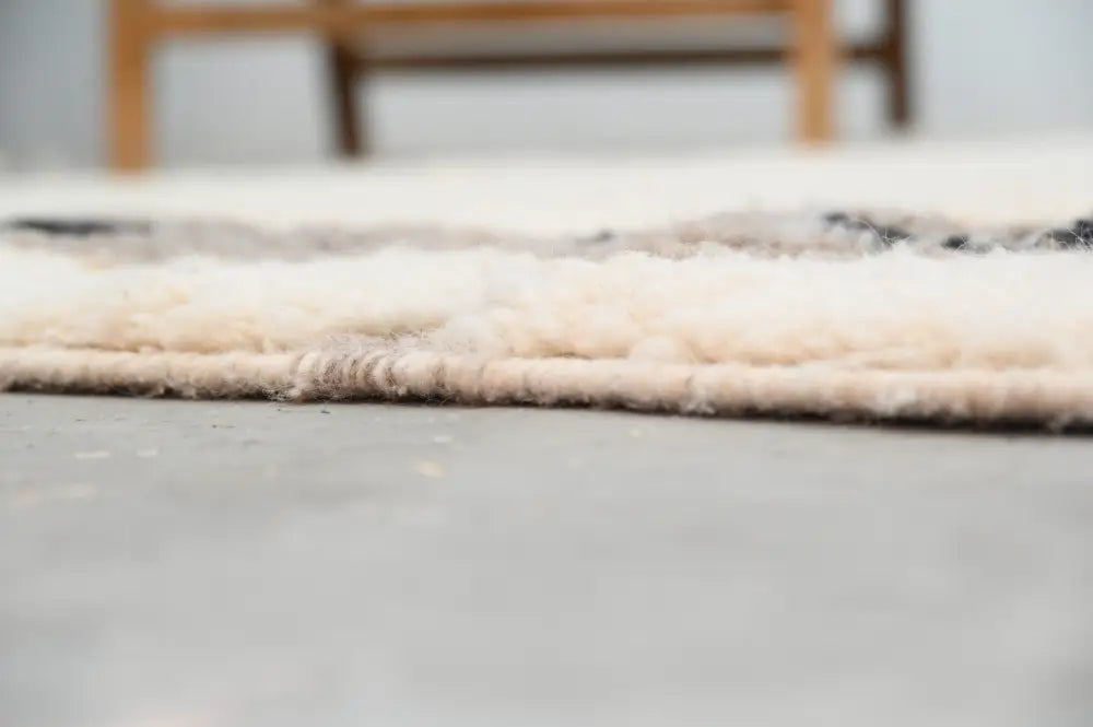 Cream-colored plush wool beni ouarain rug with soft texture and subtle gray accents moroccan handmade design