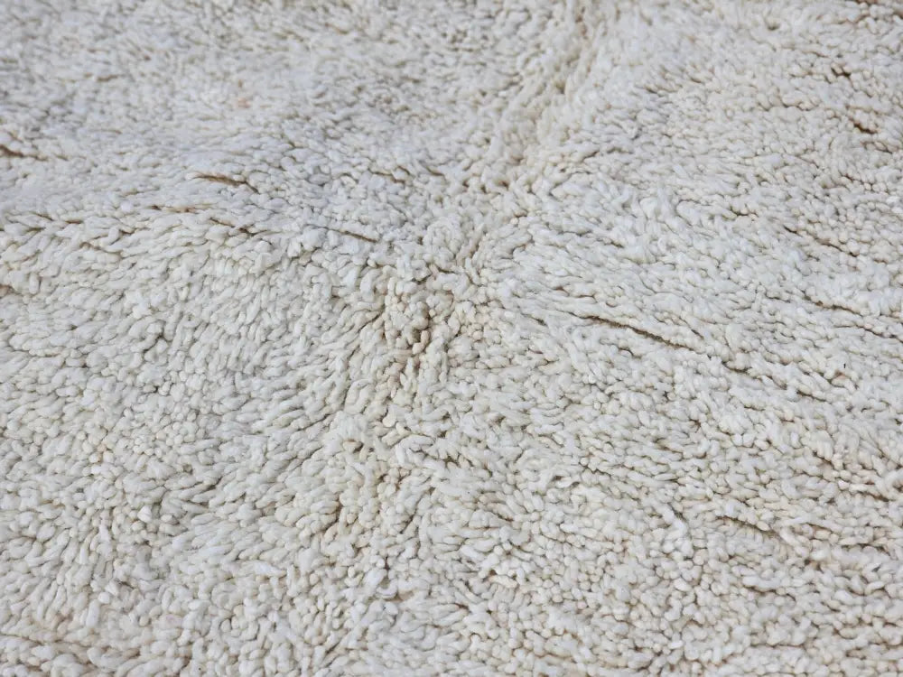 Cream-colored plush moroccan handmade beni ouarain rug with dense textured natural fiber weave 464 x 360 cm