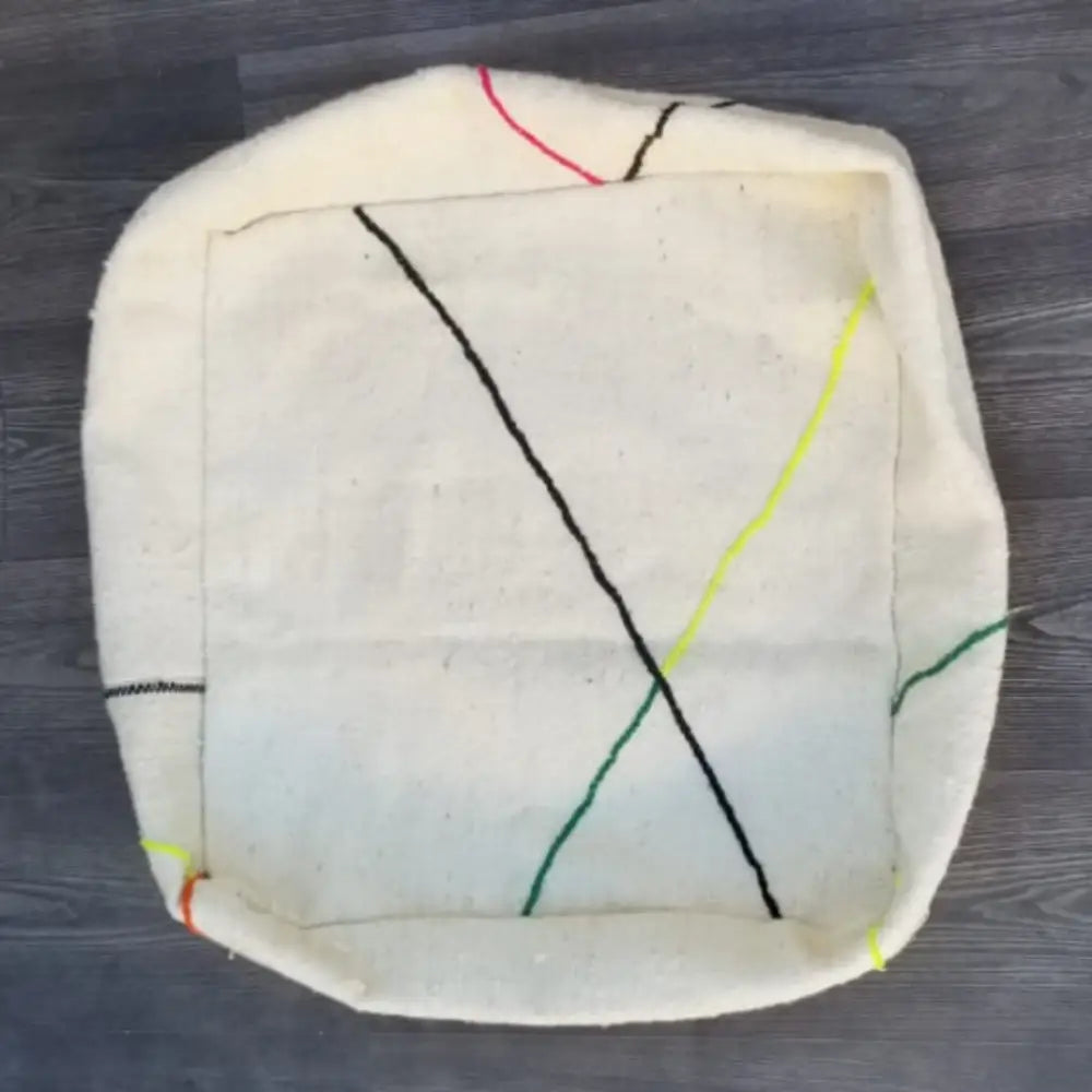 Off-white decorbites moroccan handmade pouf 60cm x 60cm with textured fabric and colorful embroidered lines