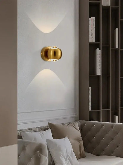 Gold-toned spherical brass led wall sconce with modern minimalist design from decorbites™ moroccan modern black brass led wall lamp
