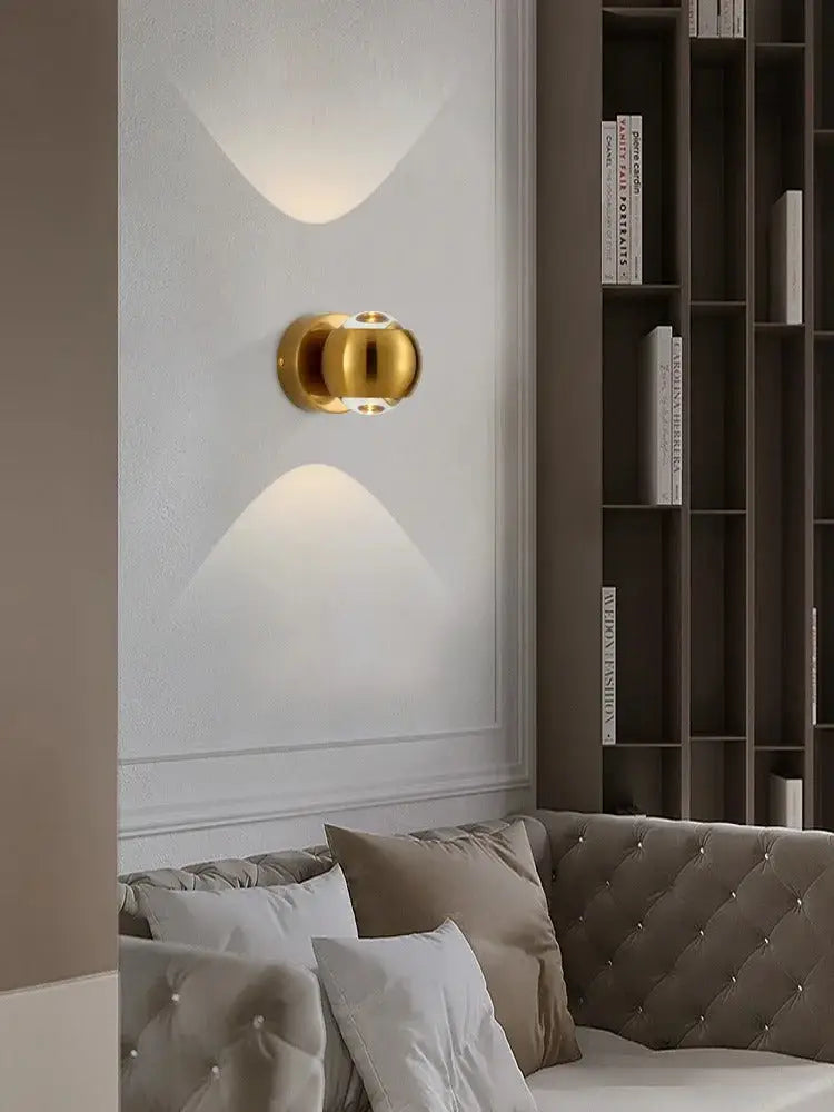 Gold-toned spherical brass led wall sconce with modern minimalist design from decorbites™ moroccan modern black brass led wall lamp