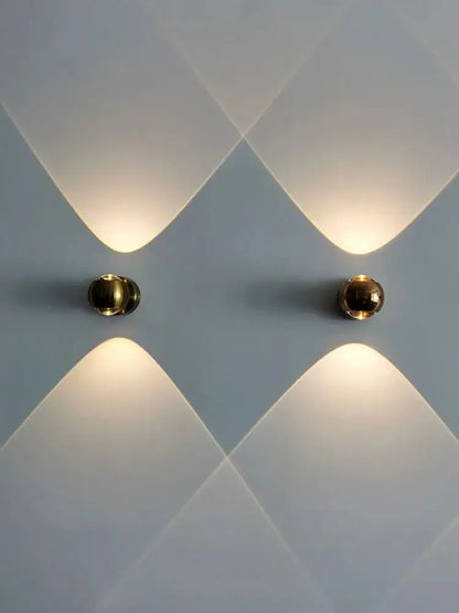 DecorBites™ Moroccan modern black brass led wall lamp with gold-toned spherical sconces and warm focused light beams