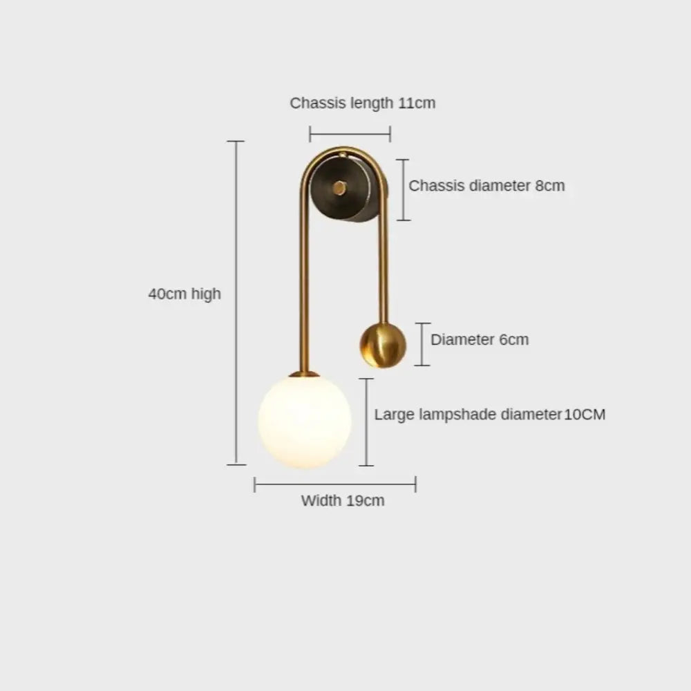 Modern gold wall sconces with curved arm, black circular base, and large frosted glass lampshade for elegant decor