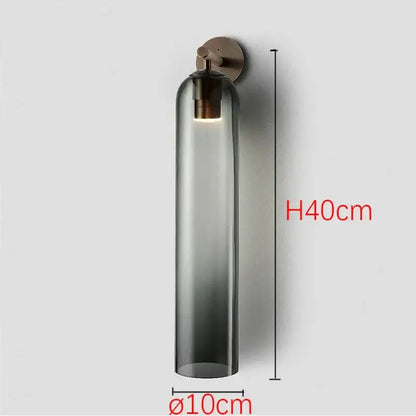 Sleek glass wall sconce with dark smoked glass shade and brushed brass hardware compatible with energy-efficient led bulbs