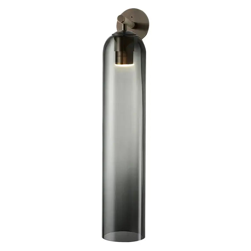 Decorbites™ sleek glass wall sconce with a tall cylindrical dark gray glass shade and brushed brass mount for led bulbs