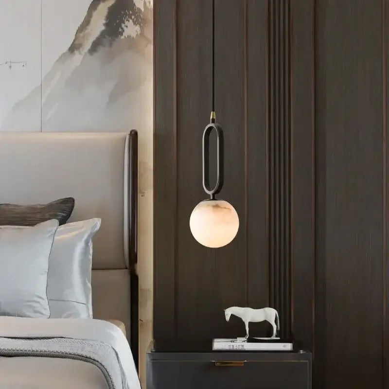 DecorBites™ Moroccan white marble pendant light with warm glowing spherical glass shade and elegant black metal frame with led bulb